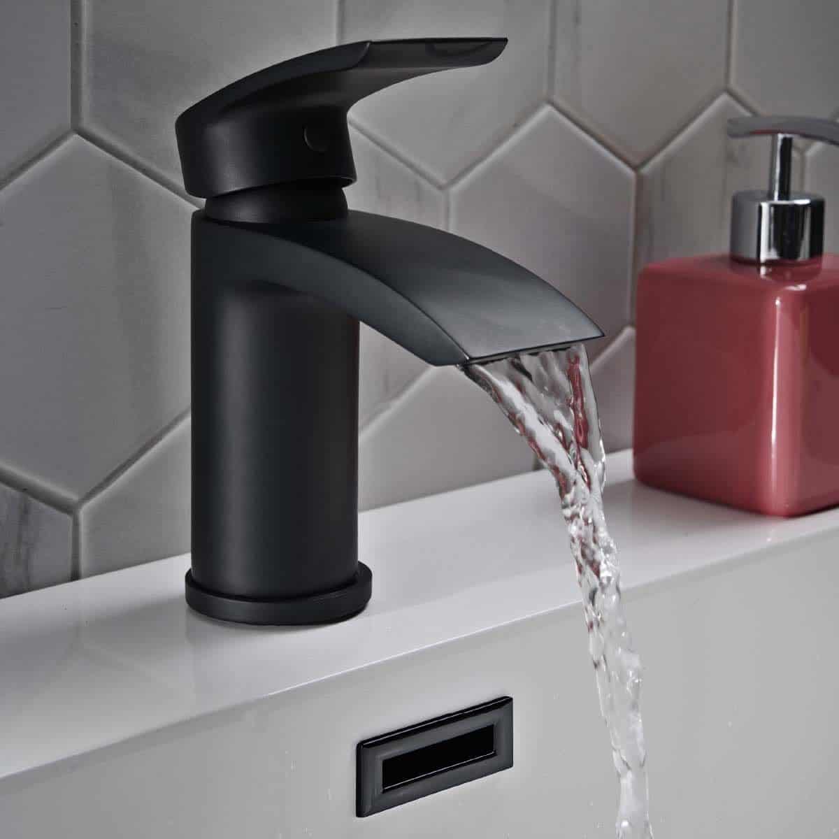 Sleek black bathroom sink mixer tap with flowing water, modern design, ideal for stylish bathrooms.