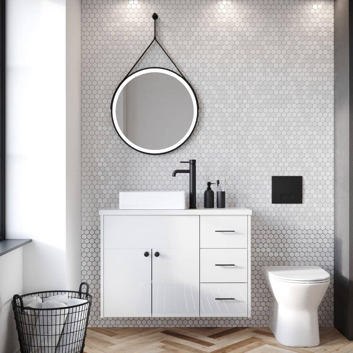 Sleek modern bathroom with a white vanity unit, black fixtures, a round illuminated mirror, and stylish black accessories on a textured hexagon tile wall. Ideal for contemporary bathroom design.