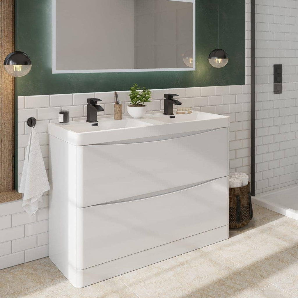 Modern double vanity bathroom unit with sleek black taps, white tiled wall, and stylish accessories, creating a contemporary bathroom design.