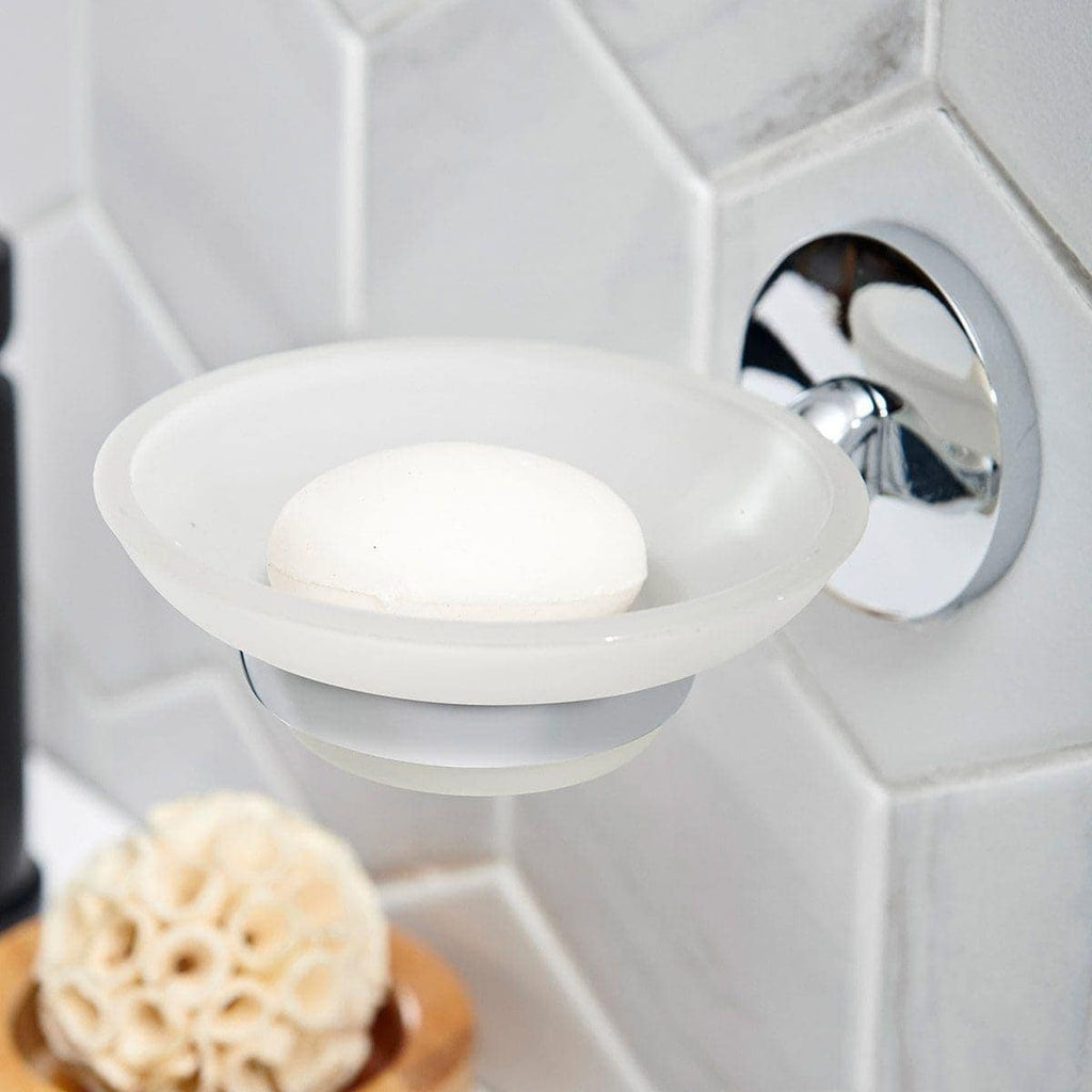 Soft white soap on a soap dish in a modern bathroom with white subway tile background, showcasing stylish and hygienic bathroom accessories.