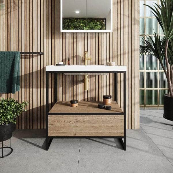 Modern bathroom vanity with wooden cabinet and white sink, accented by golden fixtures, flanked by plants and wooden paneling for a stylish, contemporary bathroom design.