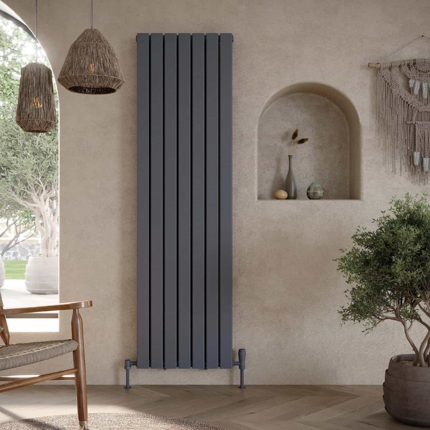 Sleek vertical modern radiator in matte grey finish, stylishly paired with natural textures and decor in a contemporary bathroom setting. Perfect for heating and aesthetic enhancement.
