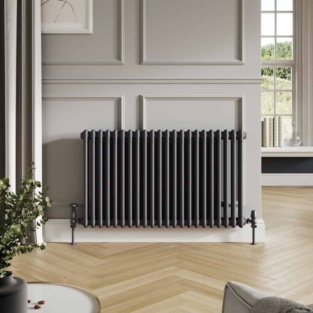 Radiator heating system in a modern bathroom with classic wall paneling and large window in a stylish, contemporary home.