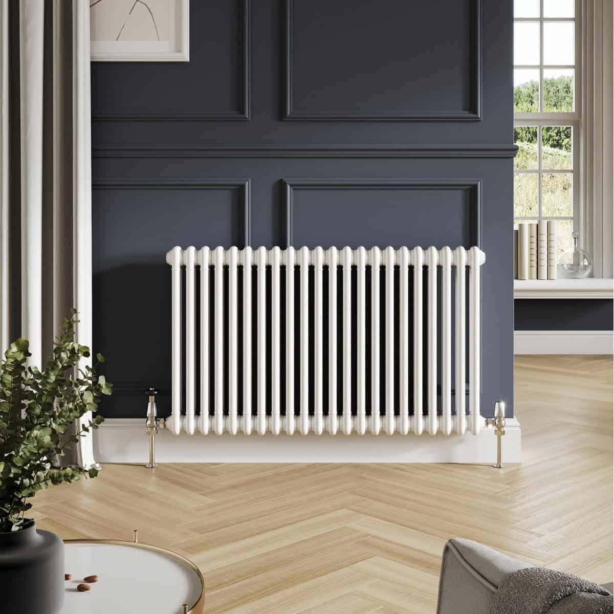 Radiator bathroom heating with modern white towel radiator in stylish black wall interior design.