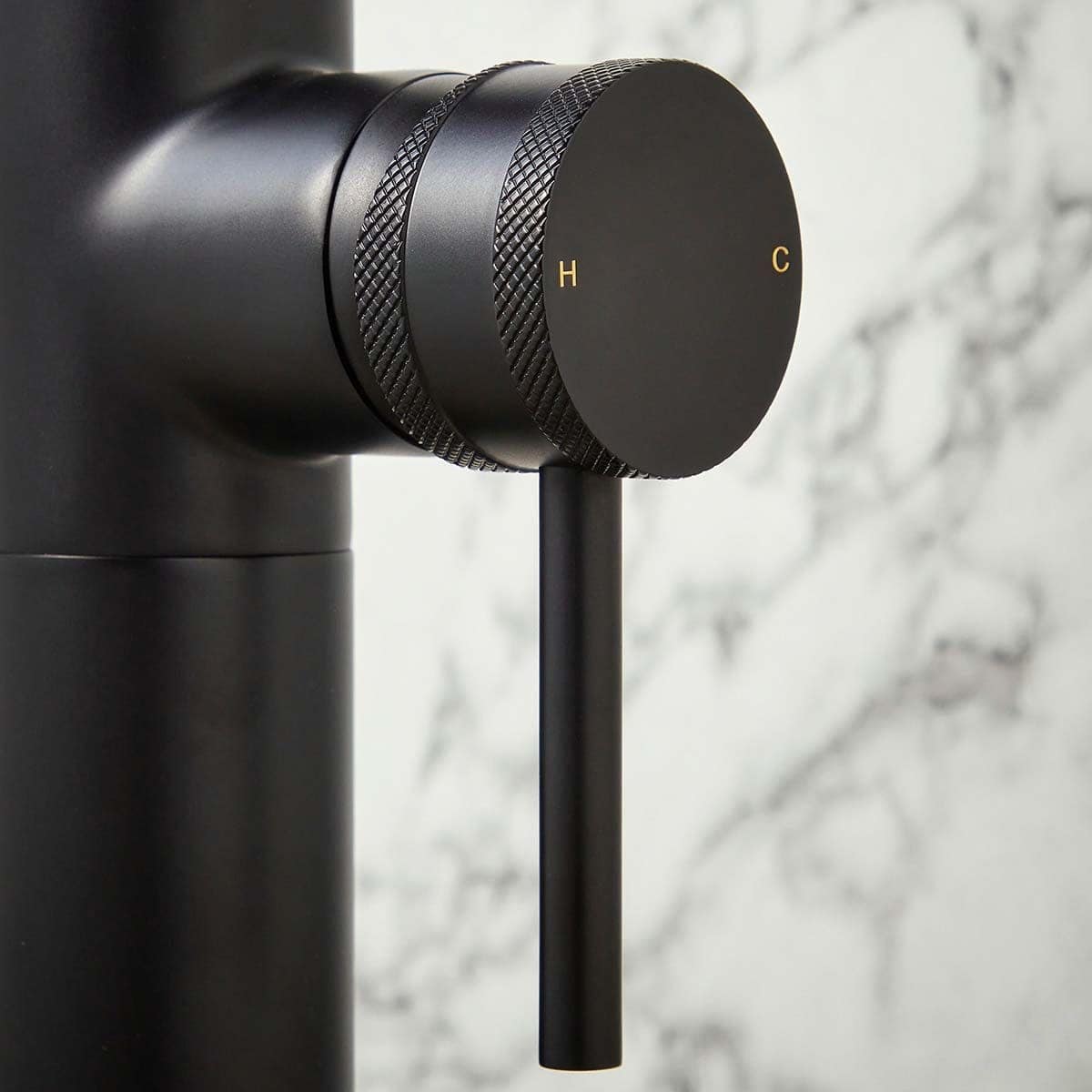 Modern black thermostatic shower control with digital temperature adjustment, sleek design, crafted for luxury bathrooms, providing precise and easy hot and cold water regulation.