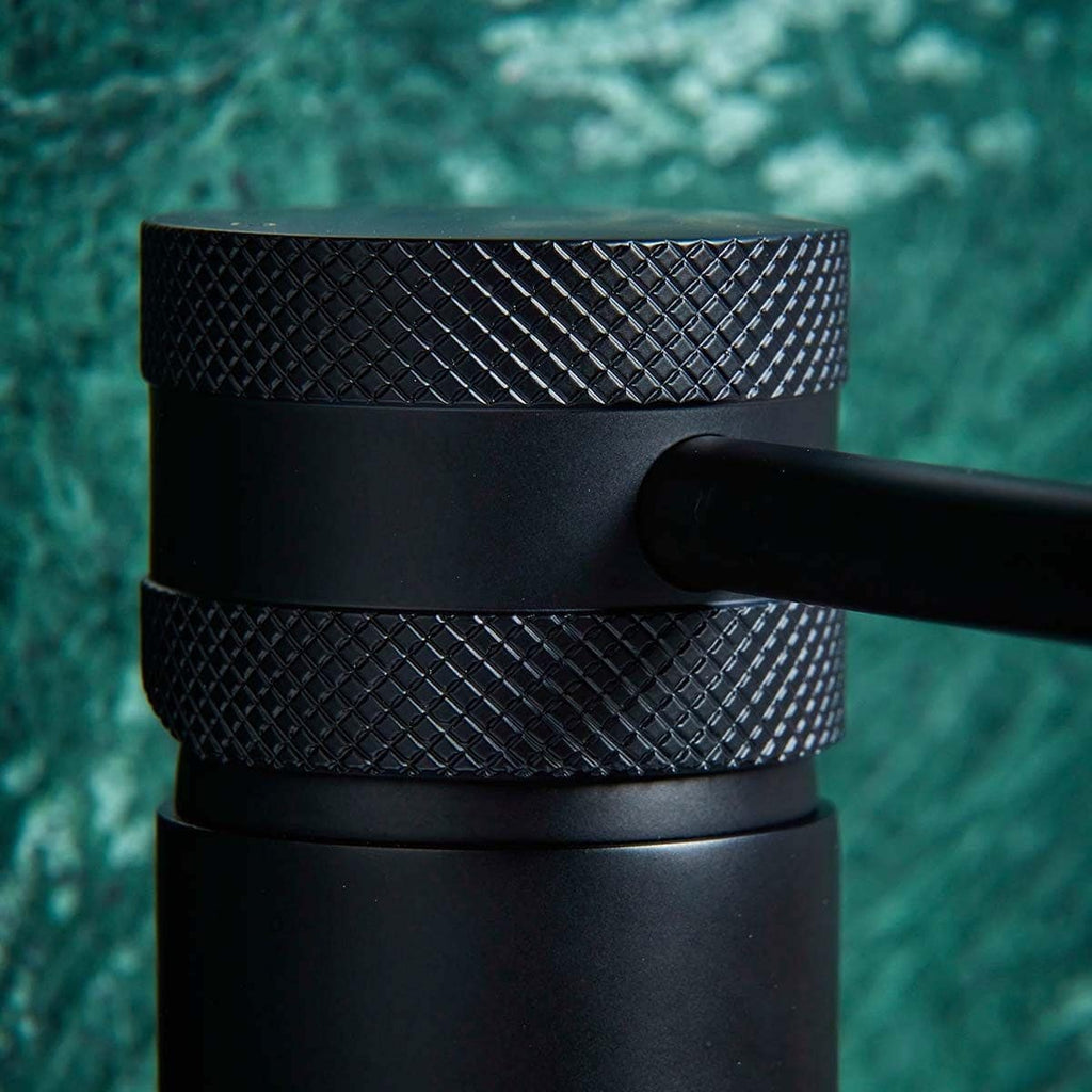 Black textured bathroom tap handle with diamond pattern for modern bathroom fixtures.