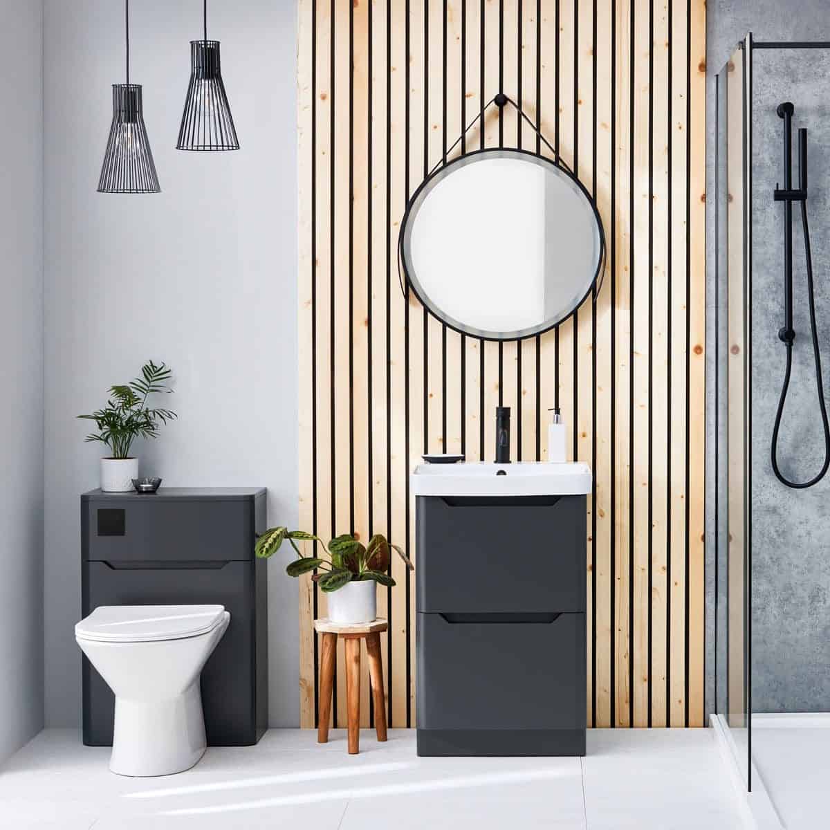 Contemporary bathroom with modern vanity unit, circular mirror, and sleek shower area featuring black fixtures, wooden slat wall and minimalist design, perfect for stylish bathroom remodels.