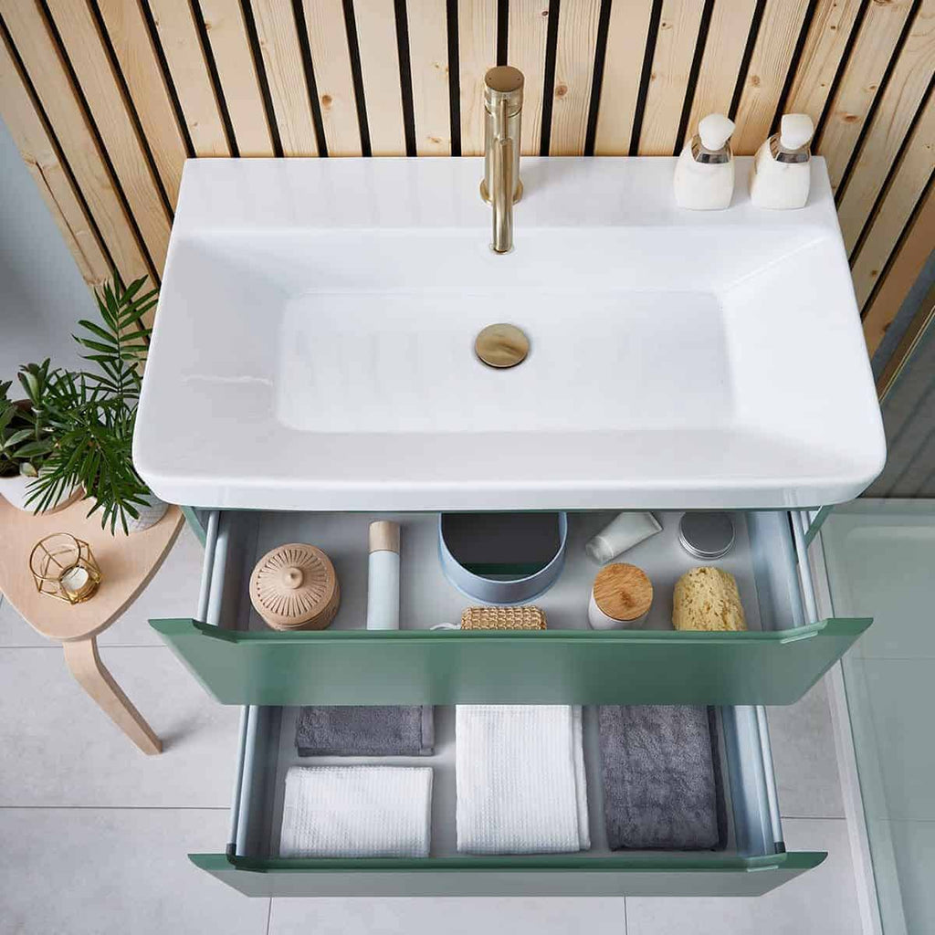 Elegant white bathroom vanity with integrated sink and open storage drawers, featuring organised skincare and towel collection, ideal for modern bubly bathrooms.