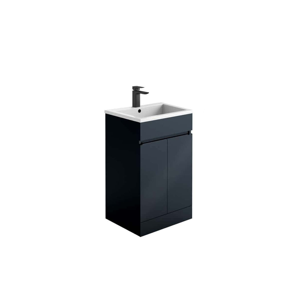 Modern bathroom vanity unit with integrated sink and black tap, sleek navy blue finish, perfect for contemporary bathroom design.