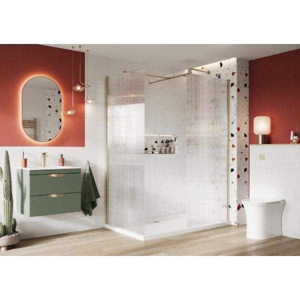 Vibrant modern bathroom with colourful accents, sleek green vanity, stylish mirror with LED lighting, decorative terrazzo wall, and contemporary shower enclosure, creating a trendy and functional space.