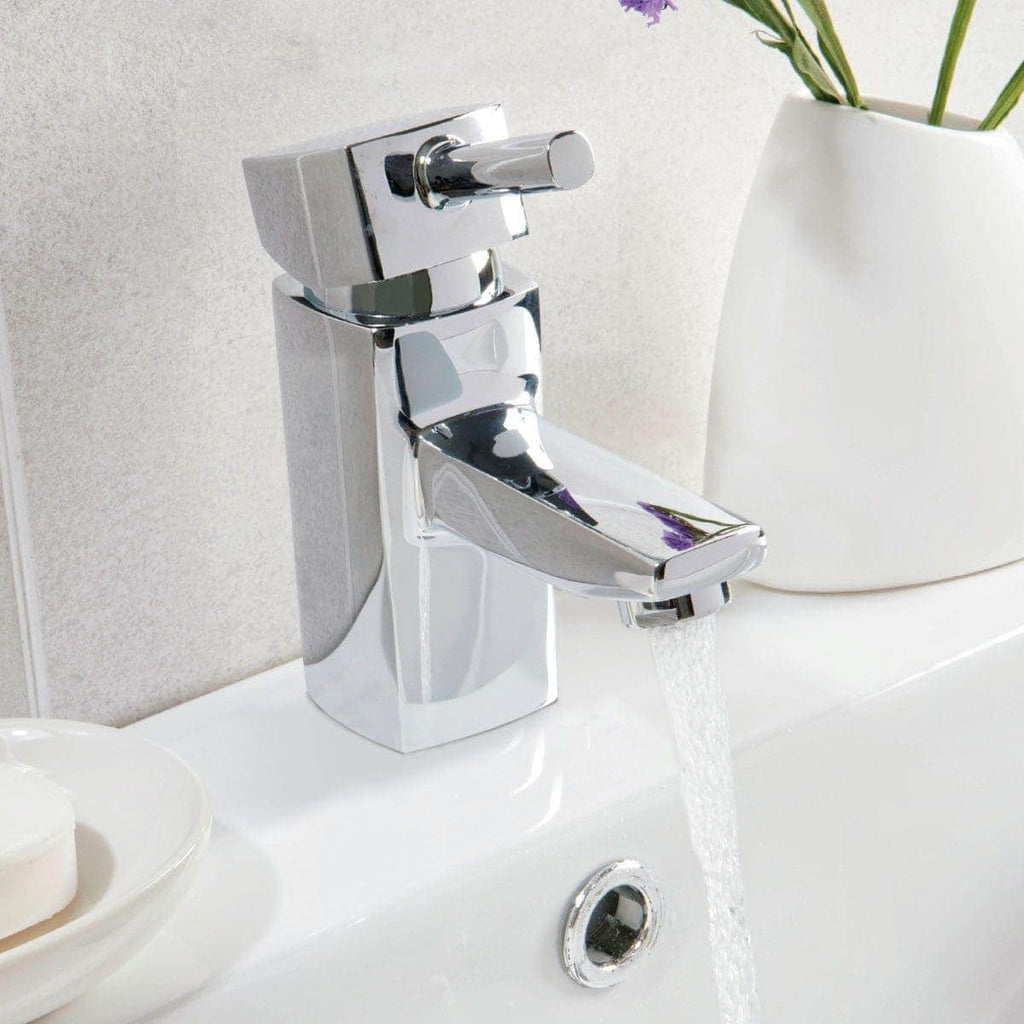 Brushed chrome bathroom tap, modern basin mixer with water flowing, sleek and stylish design, plumbing fixture for contemporary bathrooms, high-quality chrome finish for durability and elegance.