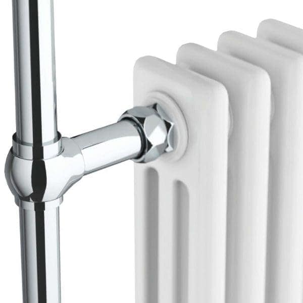Chrome radiator valve connected to a white central heating radiator, showcasing modern bathroom heating solutions.