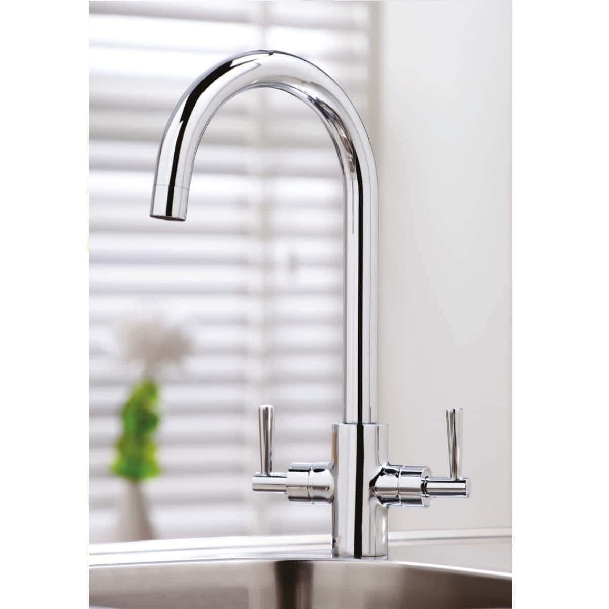 Polished chrome kitchen tap with dual handles and high-arc spout, ideal for modern bathroom or kitchen sink. Sleek, durable, and easy to operate for efficient water flow control.