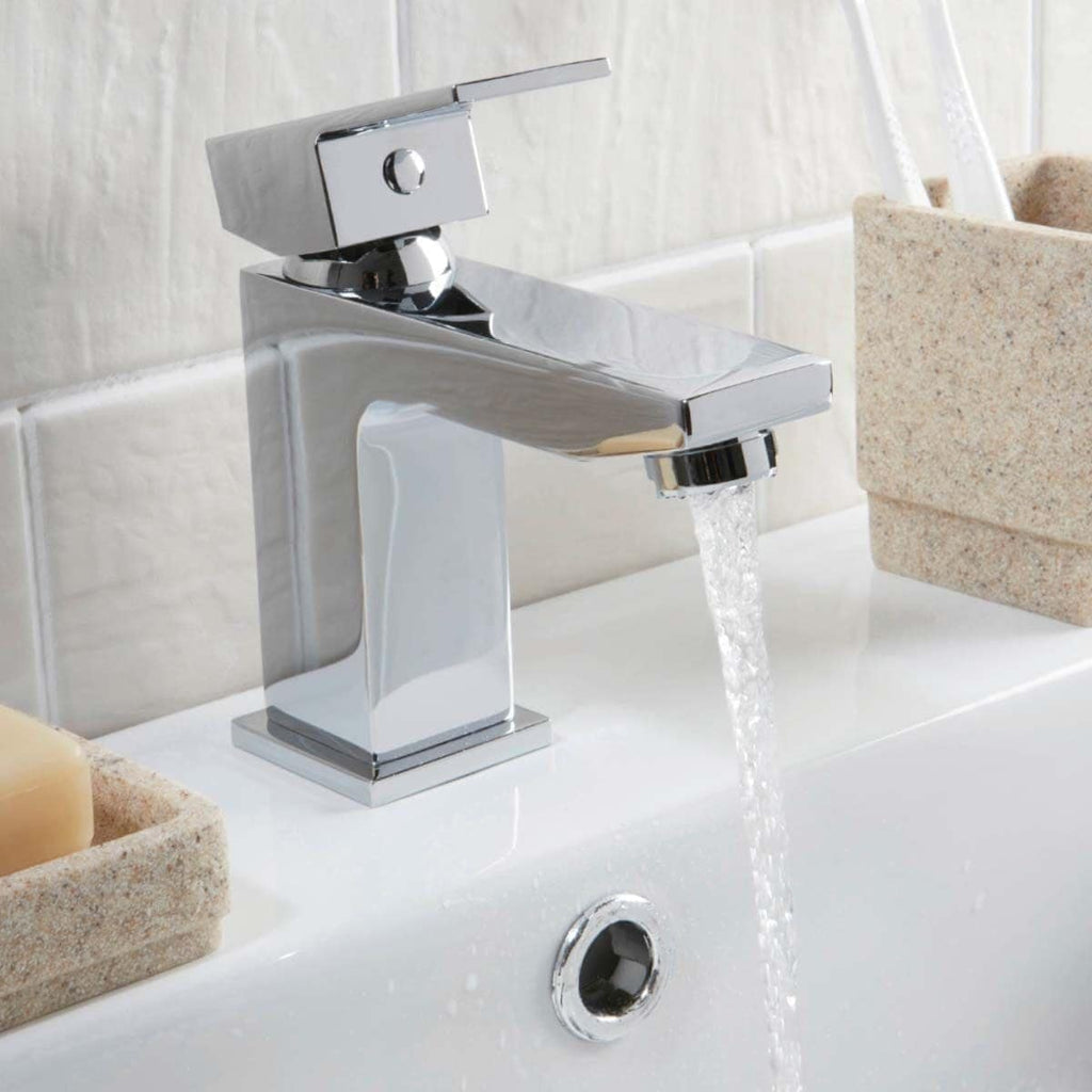 Sleek chrome bathroom faucet with water flowing, modern design, perfect for contemporary bathrooms, installed above a white basin.
