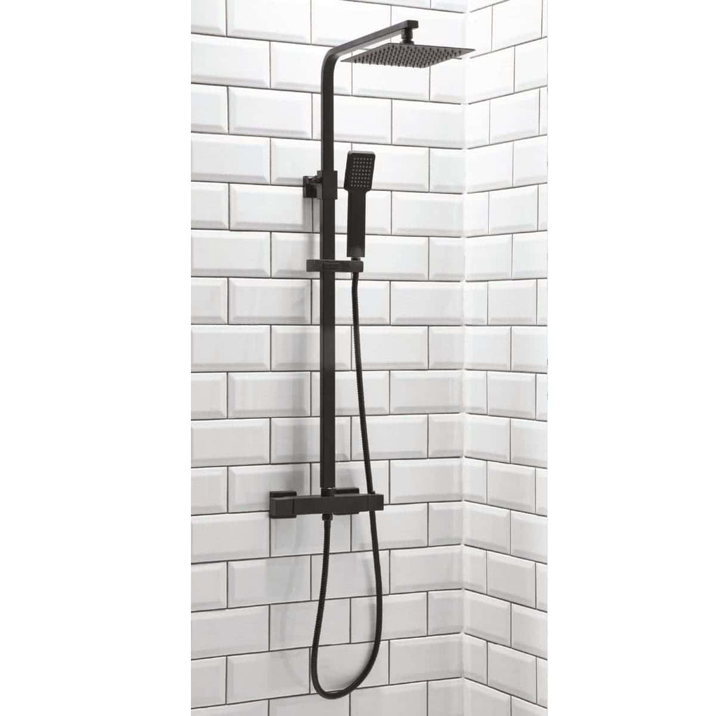 Sleek black modern shower system with rain shower head and handheld spray, mounted on white subway tiled wall, ideal for contemporary bathroom renovations and stylish shower upgrades.