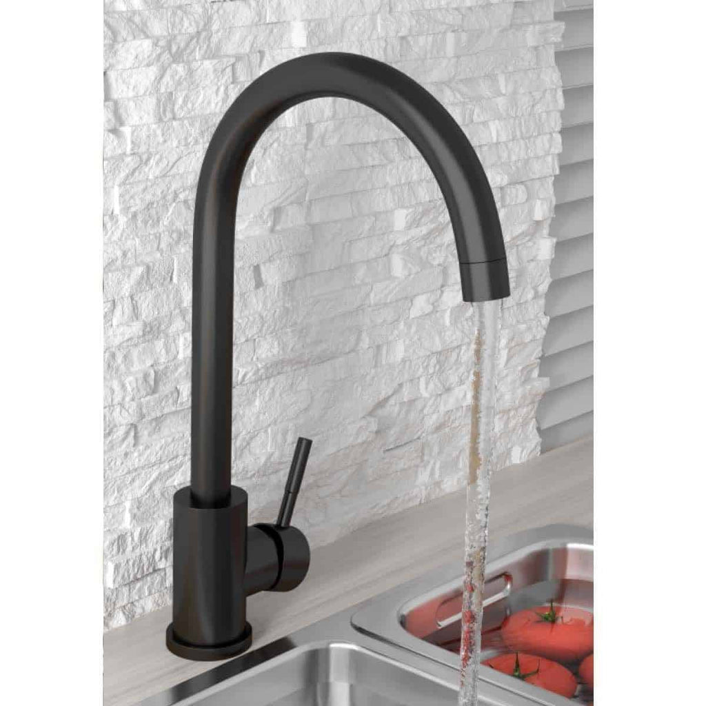 Sleek black kitchen mixer tap with a modern matte finish, installed over stainless steel sink with flowing water and fresh tomatoes underneath, in a contemporary kitchen setting.