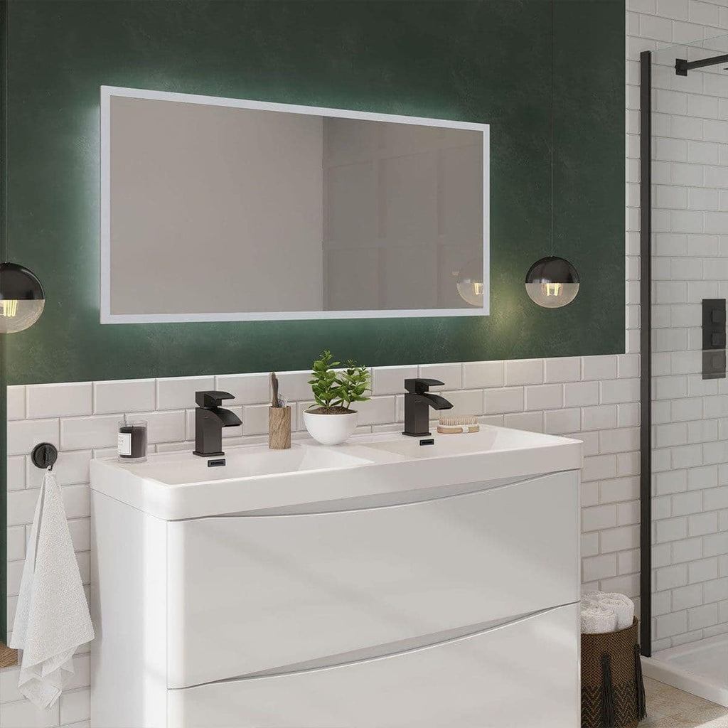 Modern double bathroom vanity with black fixtures, eco-friendly plant, stylish mirror, and contemporary lighting, creating a sleek and functional bathroom space.