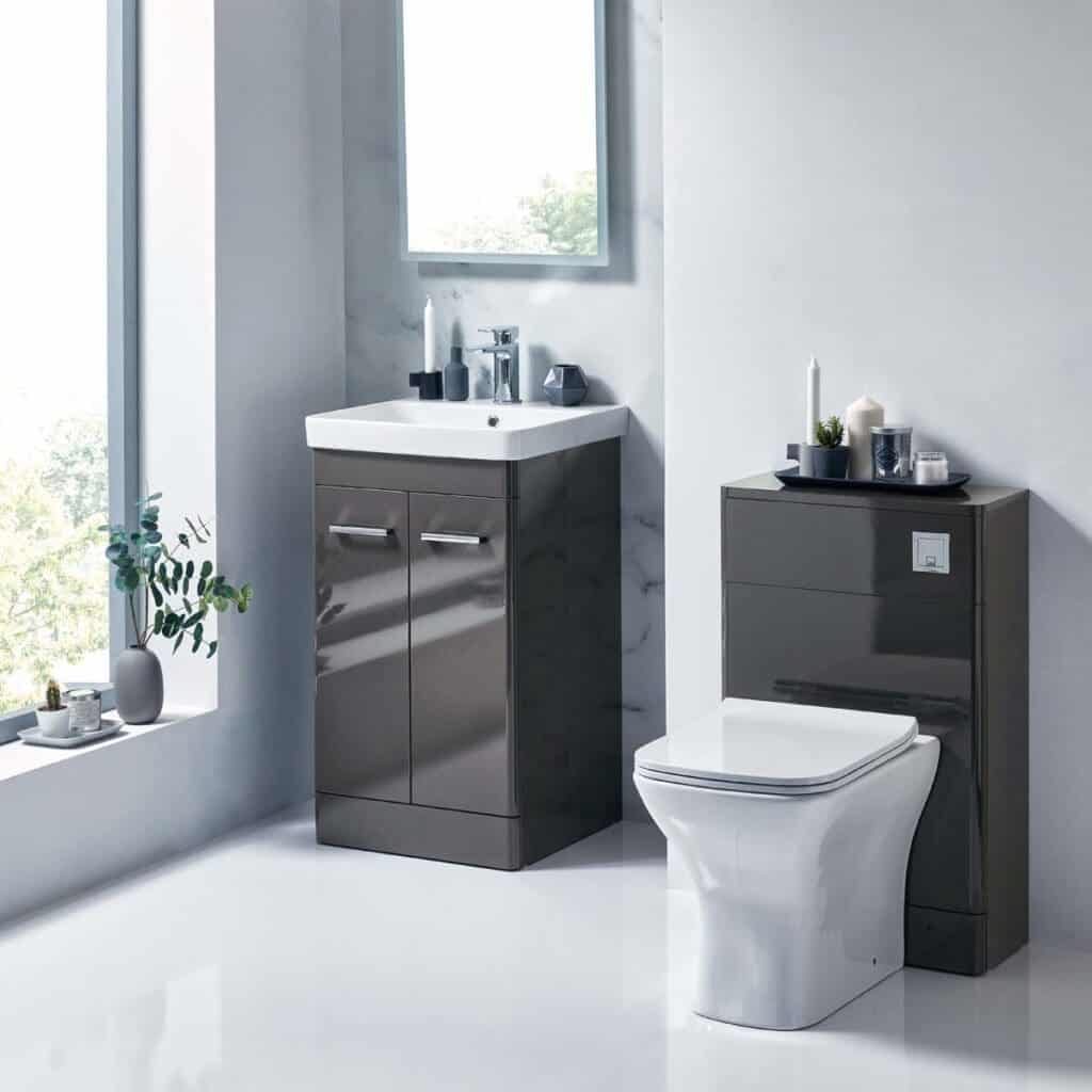 Modern grey bathroom bathroom vanity unit with integrated sink and sleek cabinetry, perfect for contemporary bathroom decor and space-saving solutions.