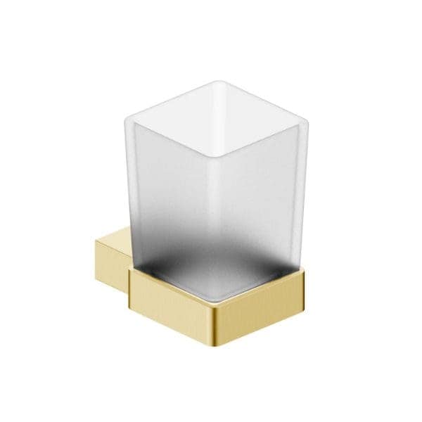 Clear glass bathroom tumbler with gold finish holder, modern and elegant bathroom accessories for a stylish bathroom upgrade.