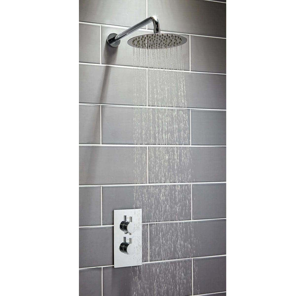 Shower head with water spray in modern bathroom tile wall, sleek chrome finish, premium bathroom design, Bubly Bathrooms.
