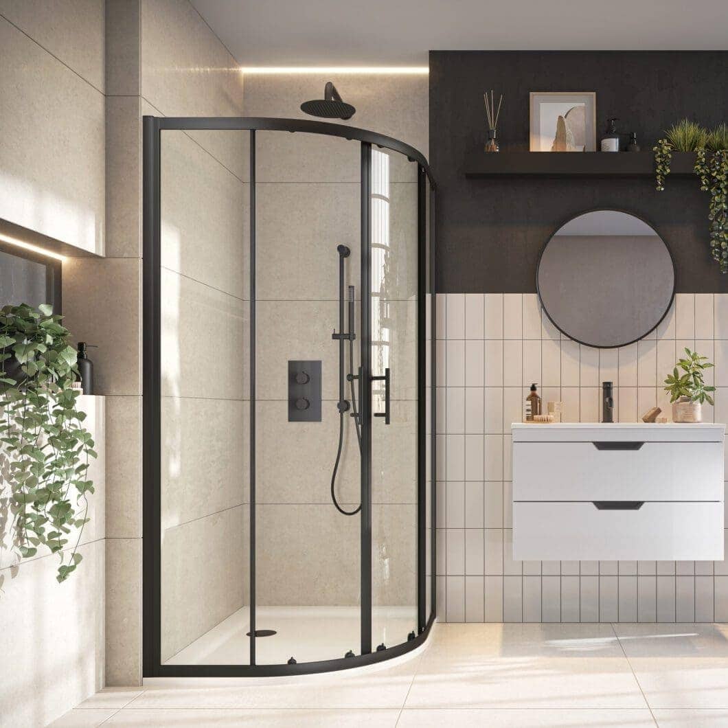 Sleek modern walk-in shower with black-framed glass enclosure in contemporary bathroom featuring beige and dark grey tiles. Ideal for stylish bathroom renovations and plumbing upgrades.