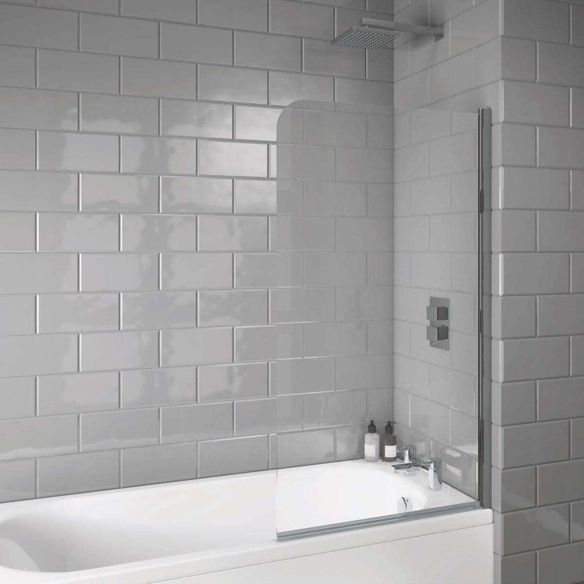 Modern grey-tiled bathroom with walk-in shower, glass screen, and built-in shower controls, creating a sleek, contemporary look for stylish bathroom renovations.