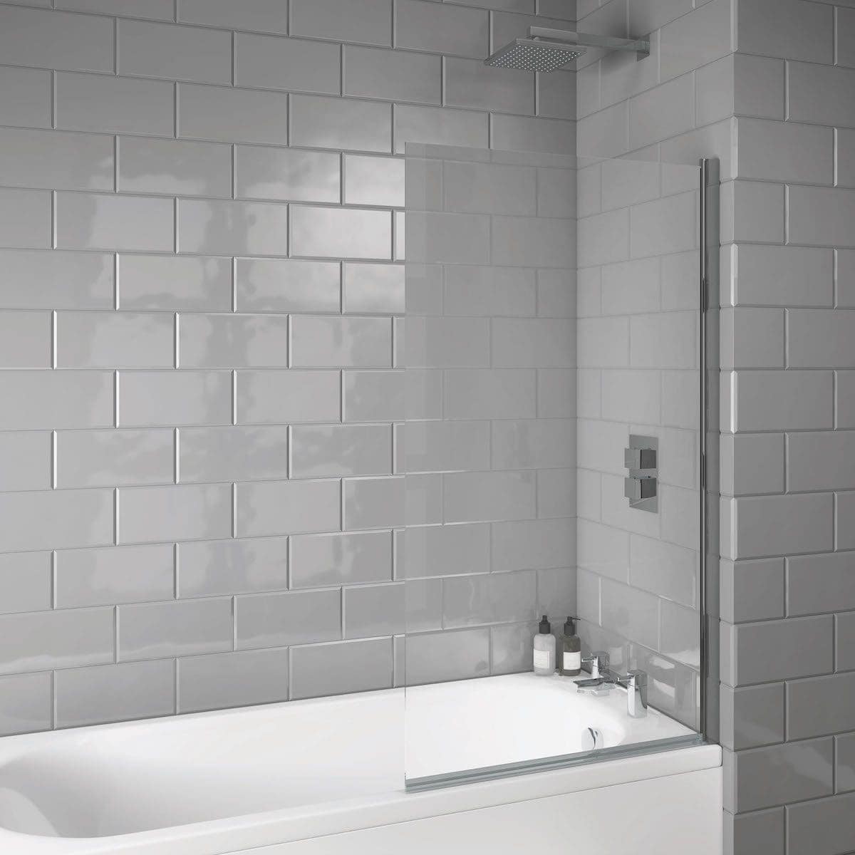 Sleek modern grey tiled bathroom with walk-in shower, glass partition, and minimalist fixtures, perfect for contemporary bathroom design.