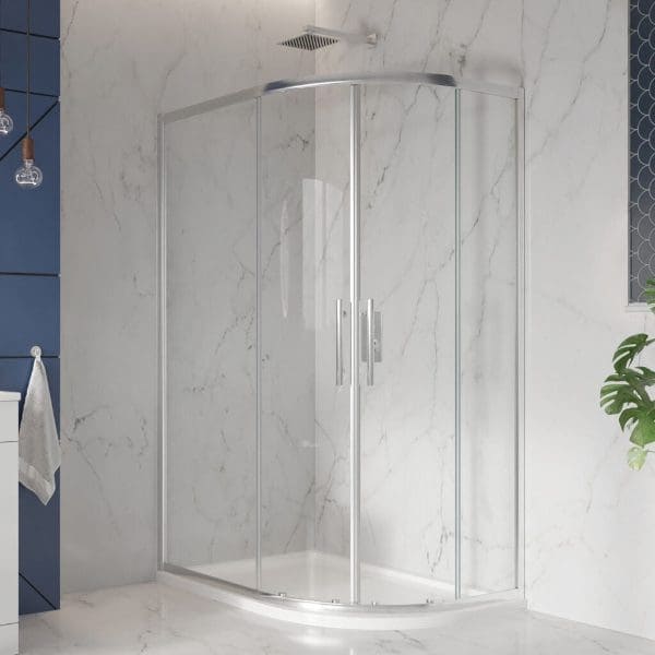Shower enclosure with sliding glass doors in a modern bathroom, featuring marble walls and minimalist fixtures for a sleek and contemporary look.