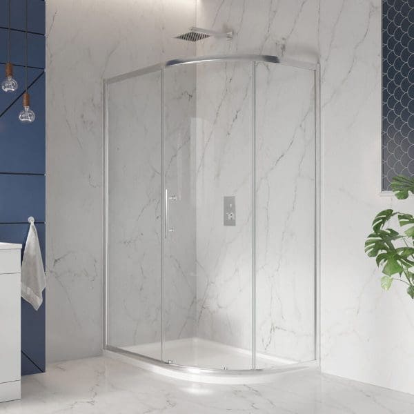 Shower enclosure with curved glass doors in a modern bathroom featuring white marble walls and minimalist fixtures.
