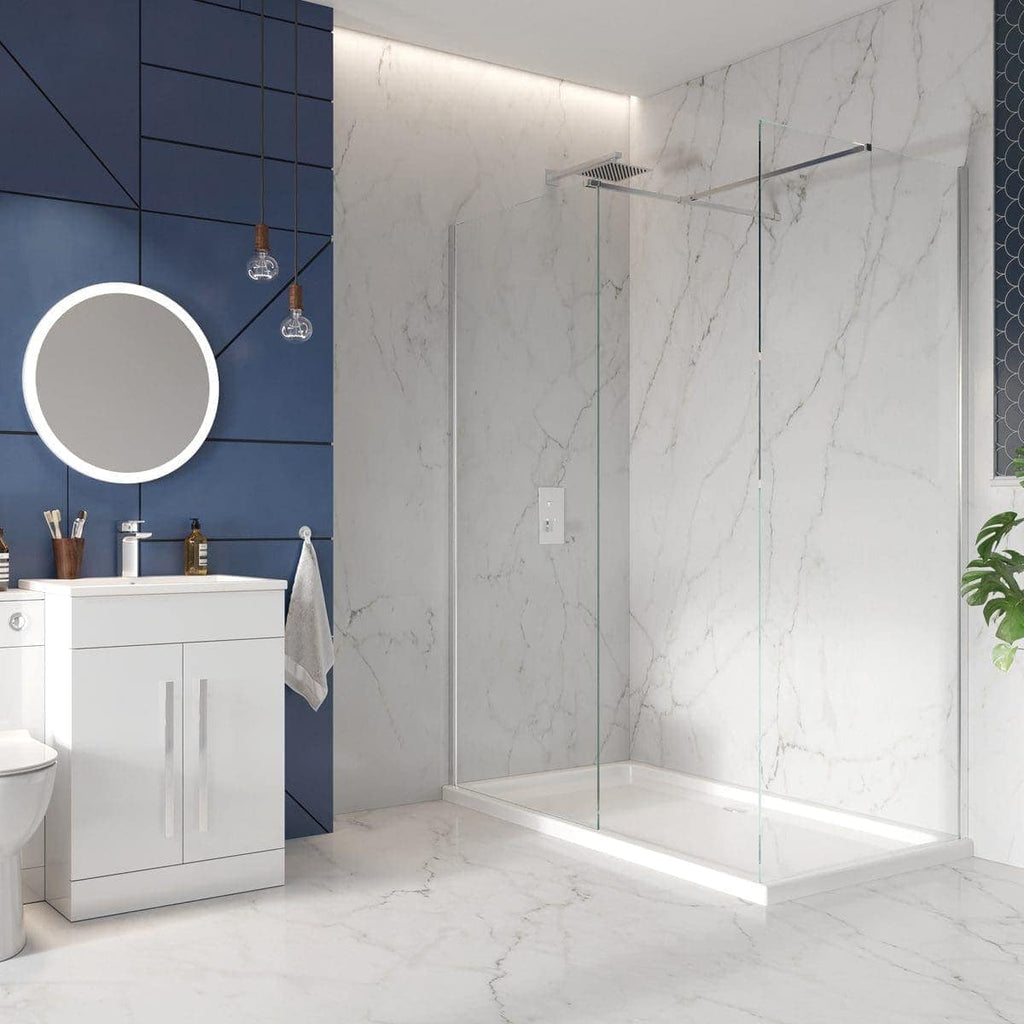 Contemporary bathroom with white marble walls and floor, modern walk-in shower with glass screens, sleek white vanity cabinet, round mirror, and minimalist decor, showcasing stylish Bubly Bathrooms design.