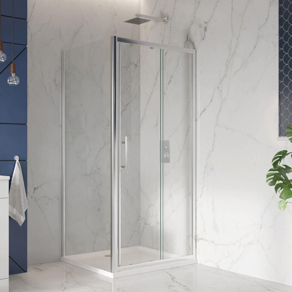 Shower enclosure with clear glass panels and aluminium frame in a modern bathroom with marble walls and floor, minimalist design for a sleek and elegant look.