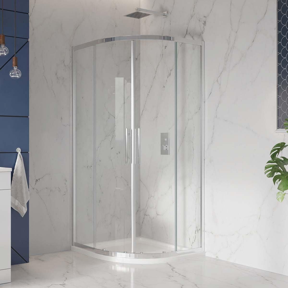 Sleek curved glass shower enclosure with chrome accents set against elegant marble walls, creating a modern and luxurious bathroom design. Perfect for contemporary Bubly bathrooms.