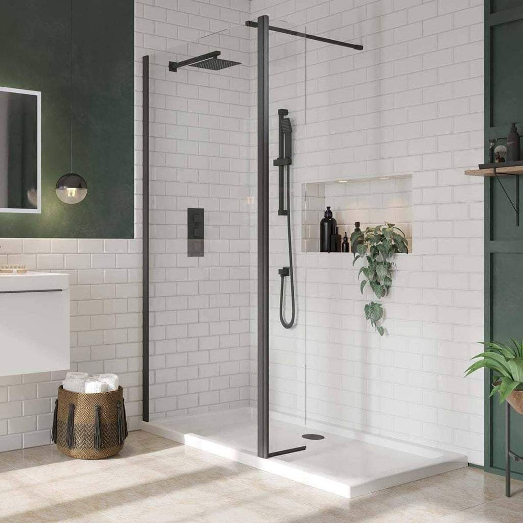 Modern walk-in shower with black fixtures and white subway tiles at Bubly Bathrooms, creating a sleek, contemporary bathroom design.