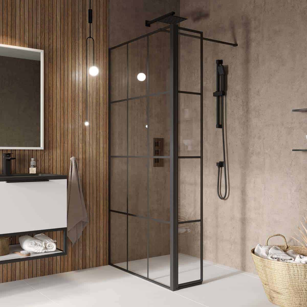 Modern black framed shower enclosure with rain showerhead and handheld shower in contemporary bathroom with wooden wall paneling and neutral tones.