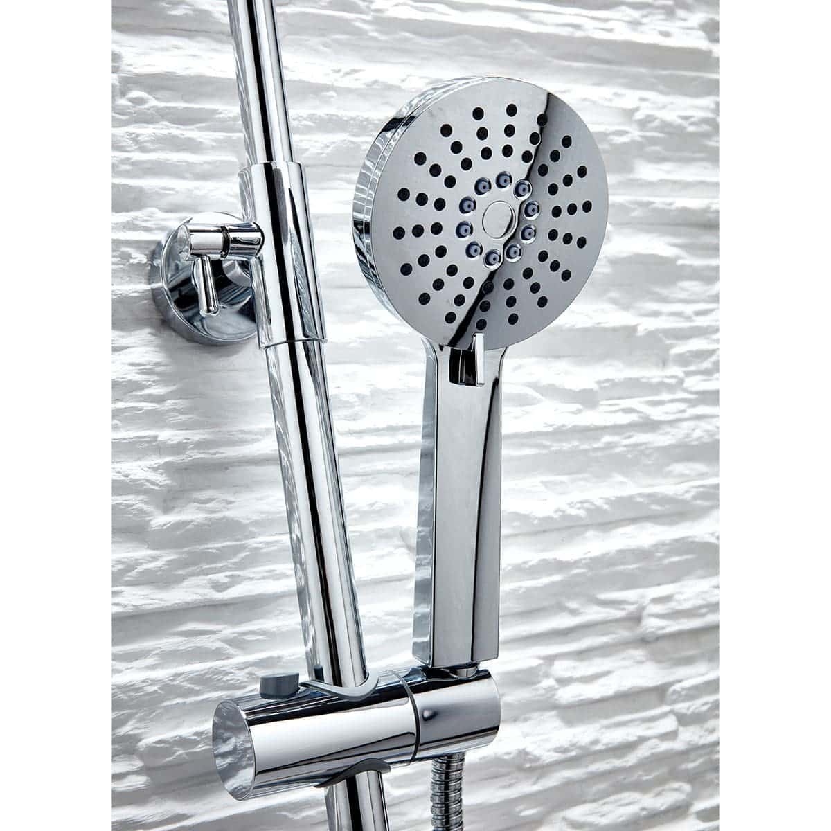 Shower head and adjustable handheld shower attachment in a modern bathroom with textured white wall tiles.