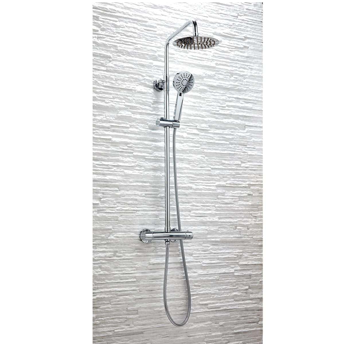 Shower system with chrome finish, rainfall showerhead, hand-held shower head, and adjustable sliding bar, installed on textured white tiled bathroom wall.