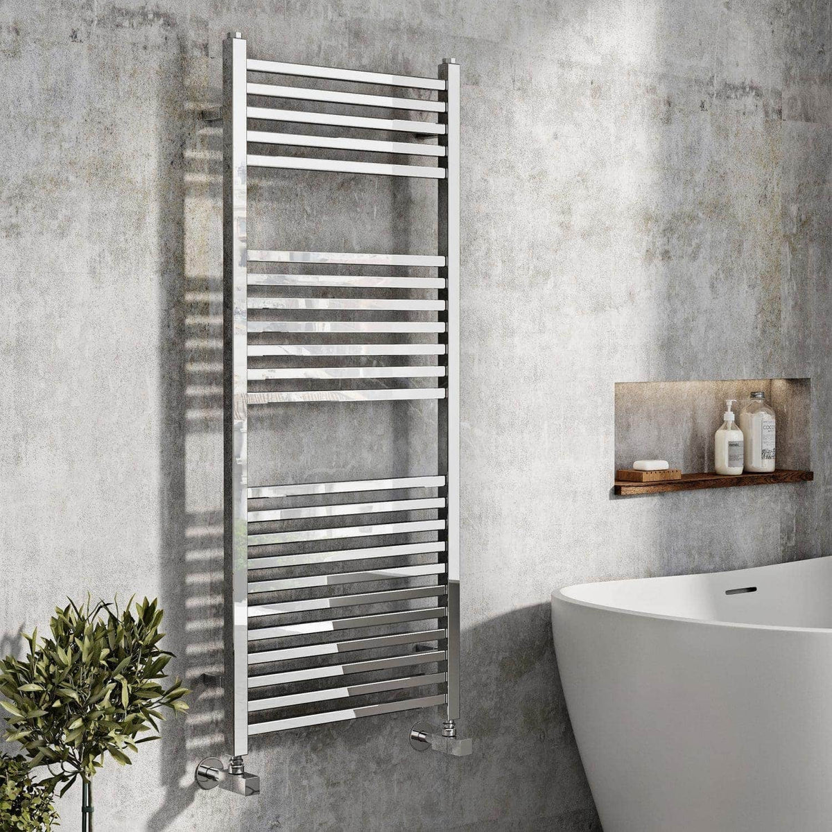 Modern stainless steel heated towel rail in contemporary bathroom design.