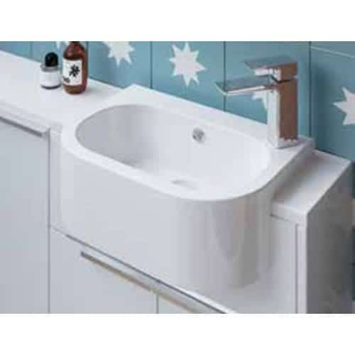 Sleek modern white bathtub with chrome faucet in contemporary bathroom setting, featuring blue star-patterned tiles and minimalistic design elements.