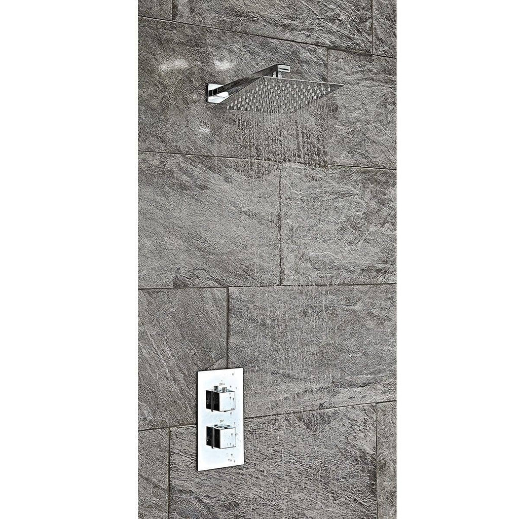 Shower head with rainfall design installed on a textured stone bathroom wall, showcasing modern bathroom fixtures and plumbing setup.