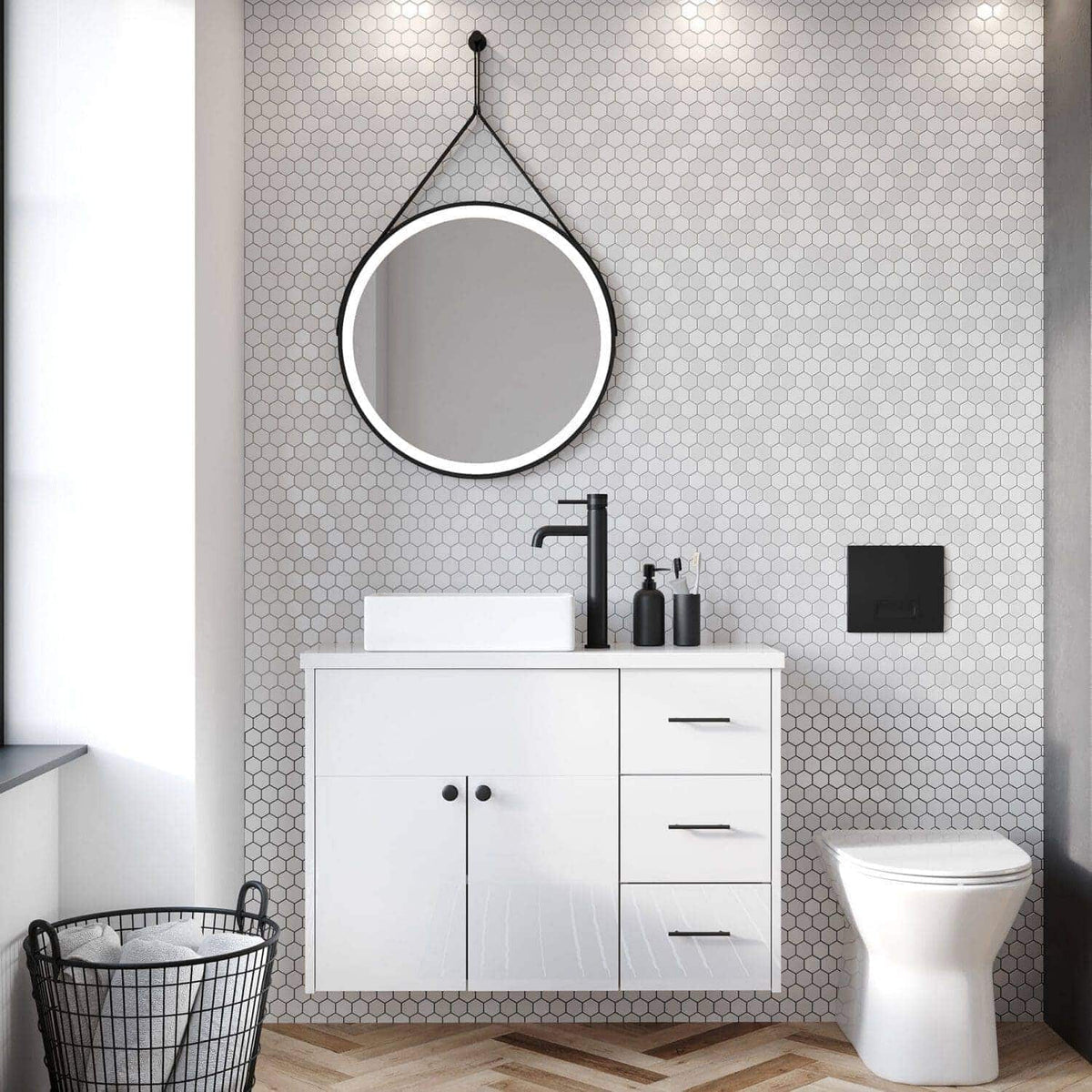Sleek modern bathroom with a white vanity unit, black fixtures, round backlit mirror, black soap dispenser, and geometric tile wall for a contemporary bathroom design.