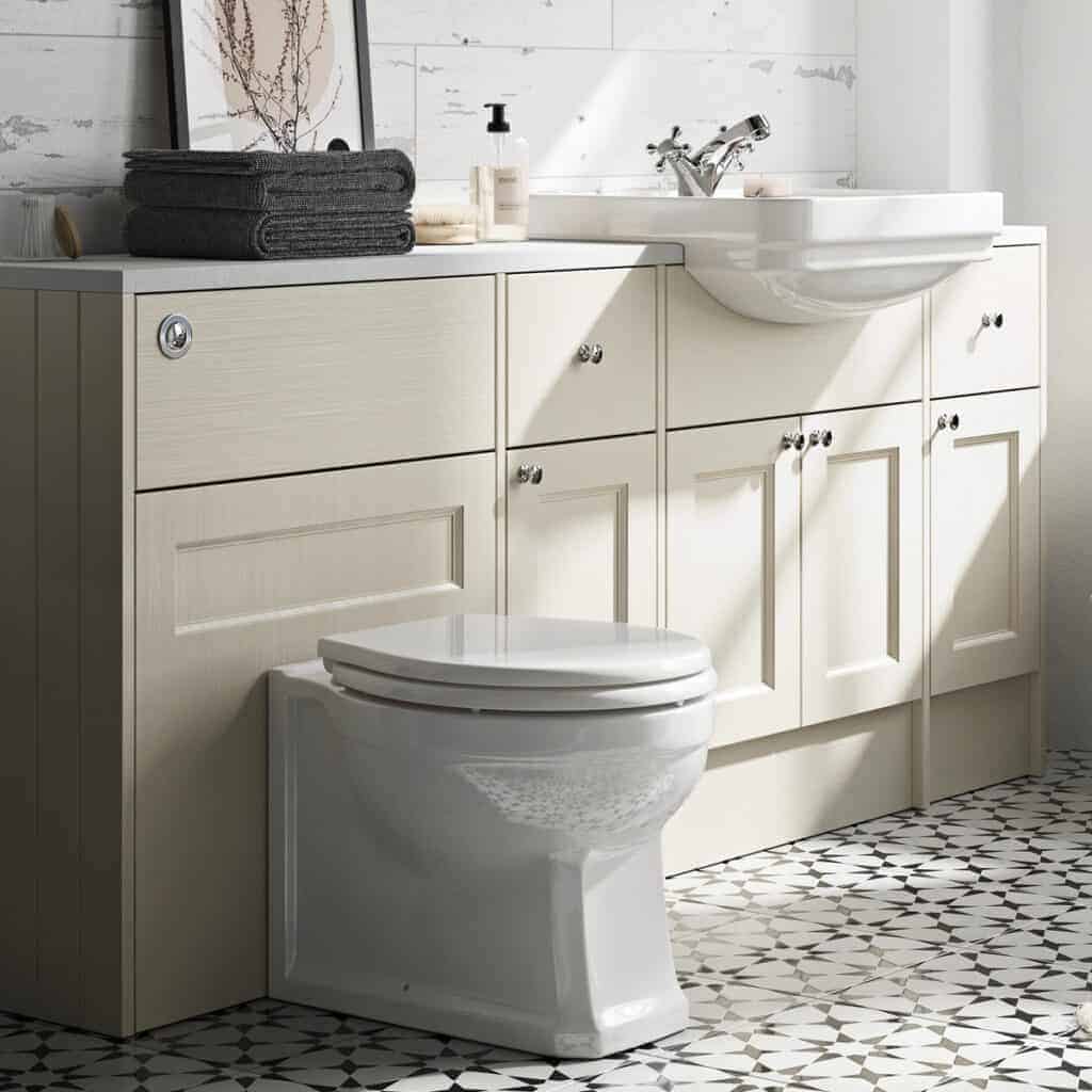 Shower bathroom cabinet with a white sink, modern faucets, and storage drawers, complemented by black towels and bathroom essentials, set in a bright, stylish bathroom interior.