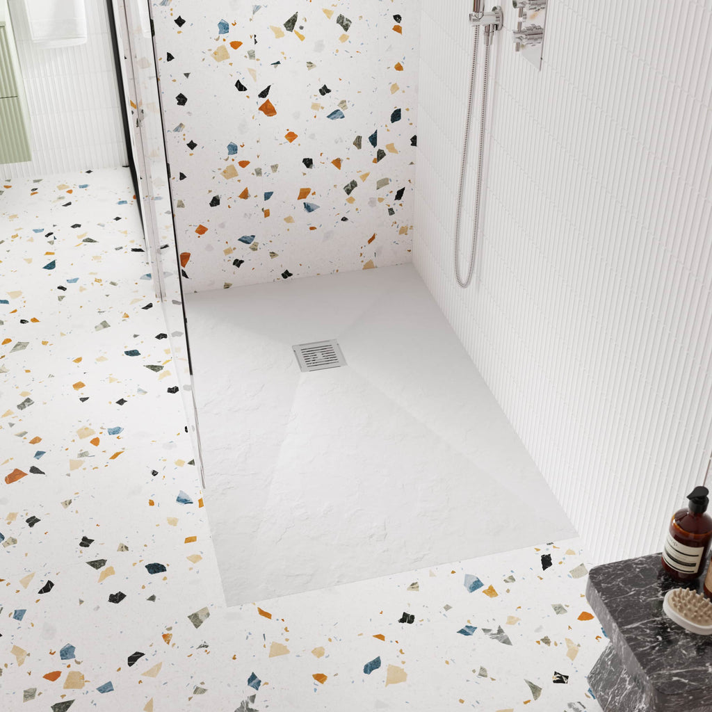 Polished terrazzo bathroom flooring with a walk-in shower area and modern design aesthetic.