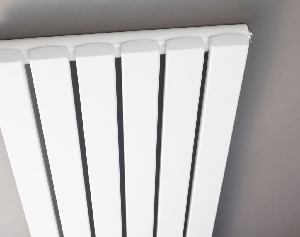 Radiator heater in a modern bathroom, white vertical panel design, focal point for bathroom heating, sleek and functional bathroom radiator, ideal for bathroom comfort and style.