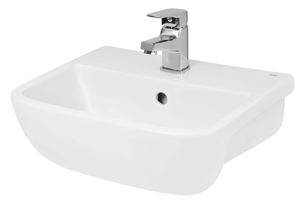 White ceramic bathroom sink with chrome tap, ideal for modern bathroom renovations and easy to install. Durable and stylish design for everyday bathroom use.
