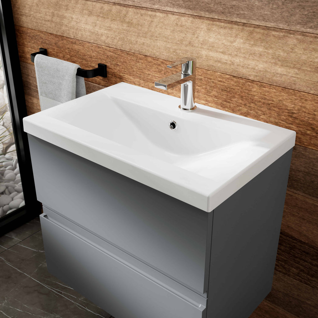 Contemporary bathroom vanity with a white ceramic sink, chrome tap, and grey cabinet, perfect for modern bathroom renovation projects.