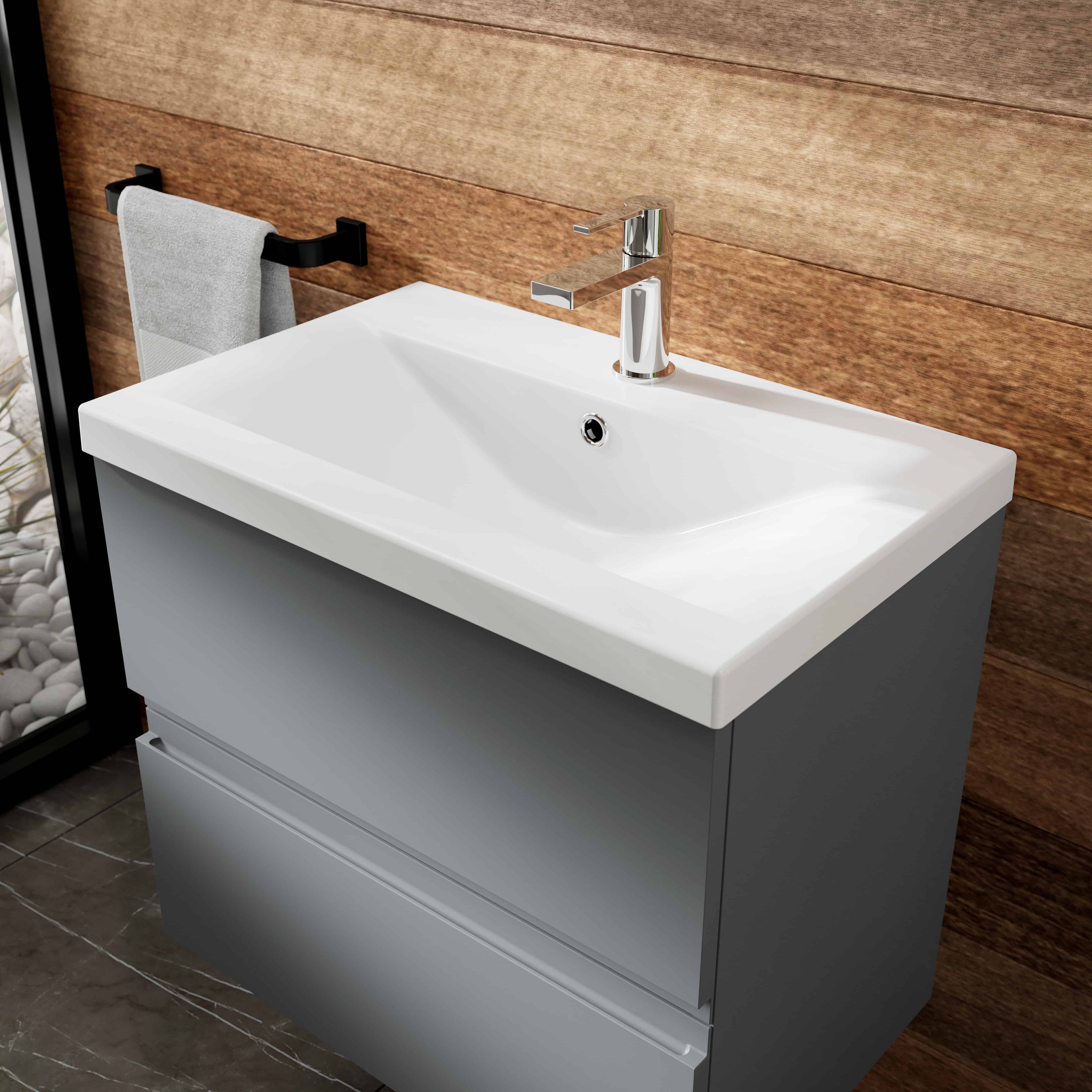 Contemporary bathroom vanity with a white ceramic sink, chrome tap, and grey cabinet, perfect for modern bathroom renovation projects.