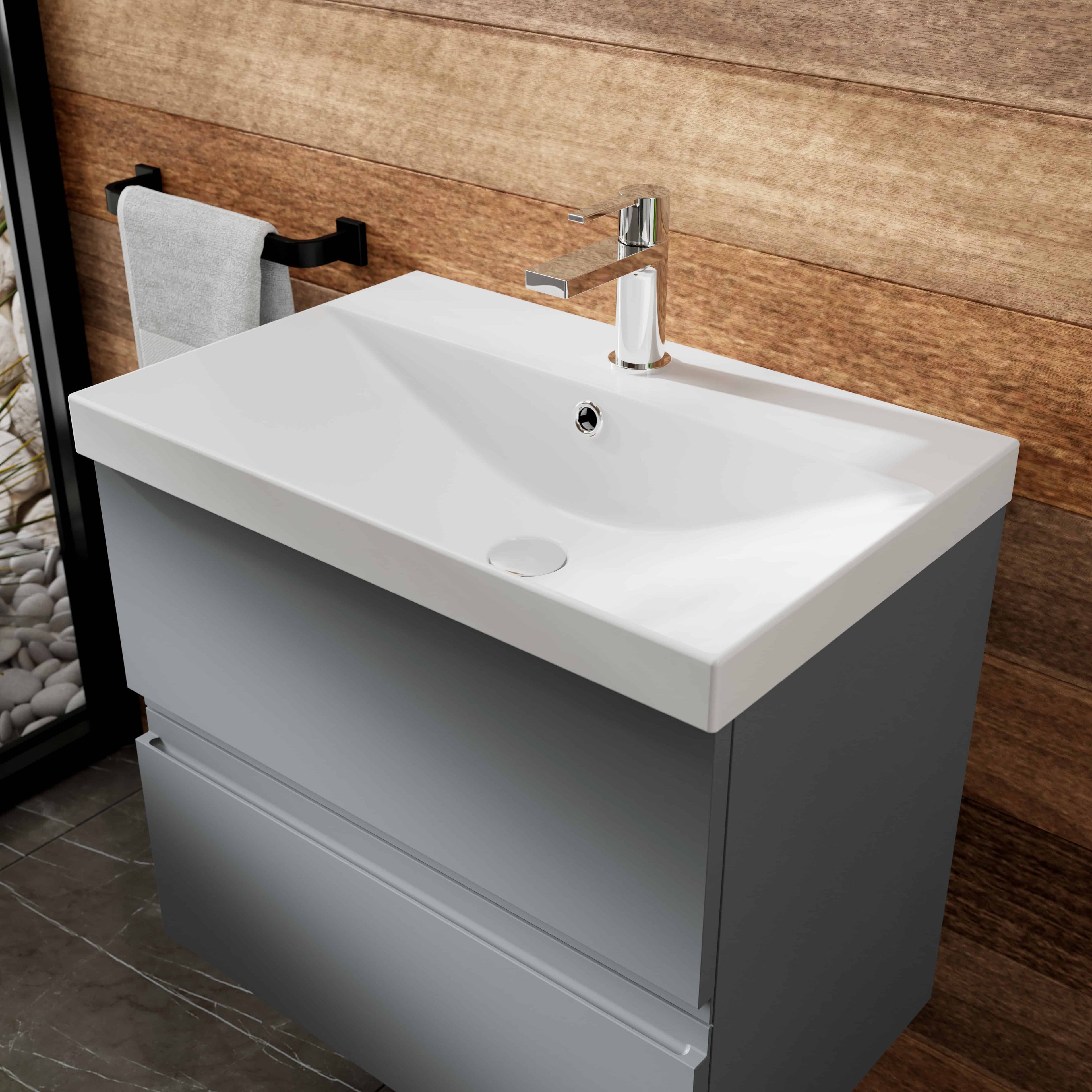 Modern white bathroom vanity with integrated sink and chrome faucet, ideal for contemporary bathrooms, showcasing stylish bathroom furniture and fixtures.
