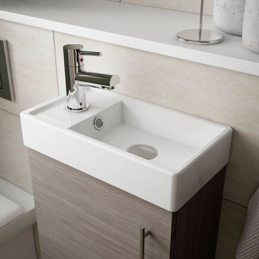 Modern ceramic bathroom sink with chrome faucet, beige wall tiles, and minimalist design from Bubly Bathrooms. Ideal for contemporary bathroom interiors.