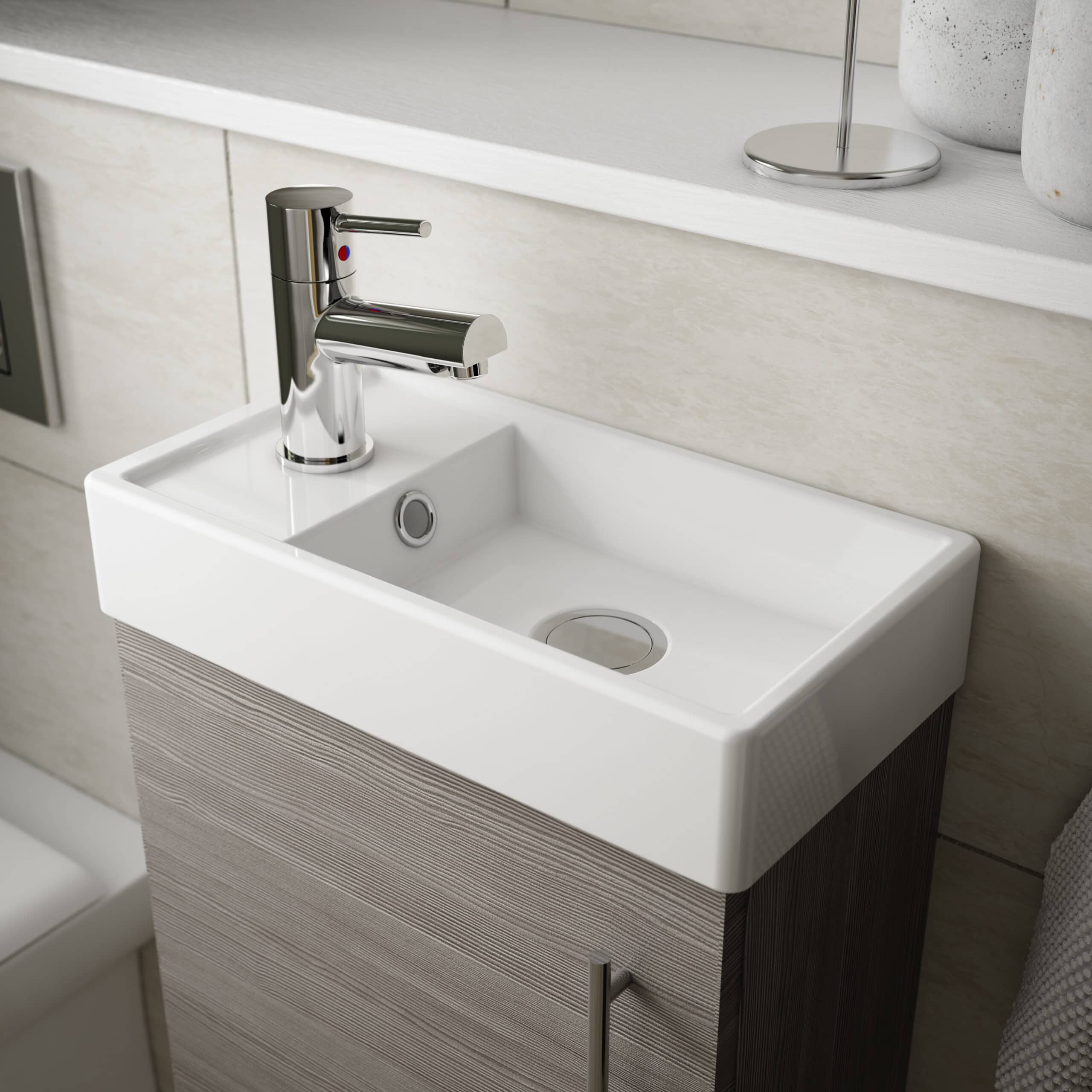 Modern ceramic bathroom sink with chrome faucet, beige wall tiles, and minimalist design from Bubly Bathrooms. Ideal for contemporary bathroom interiors.