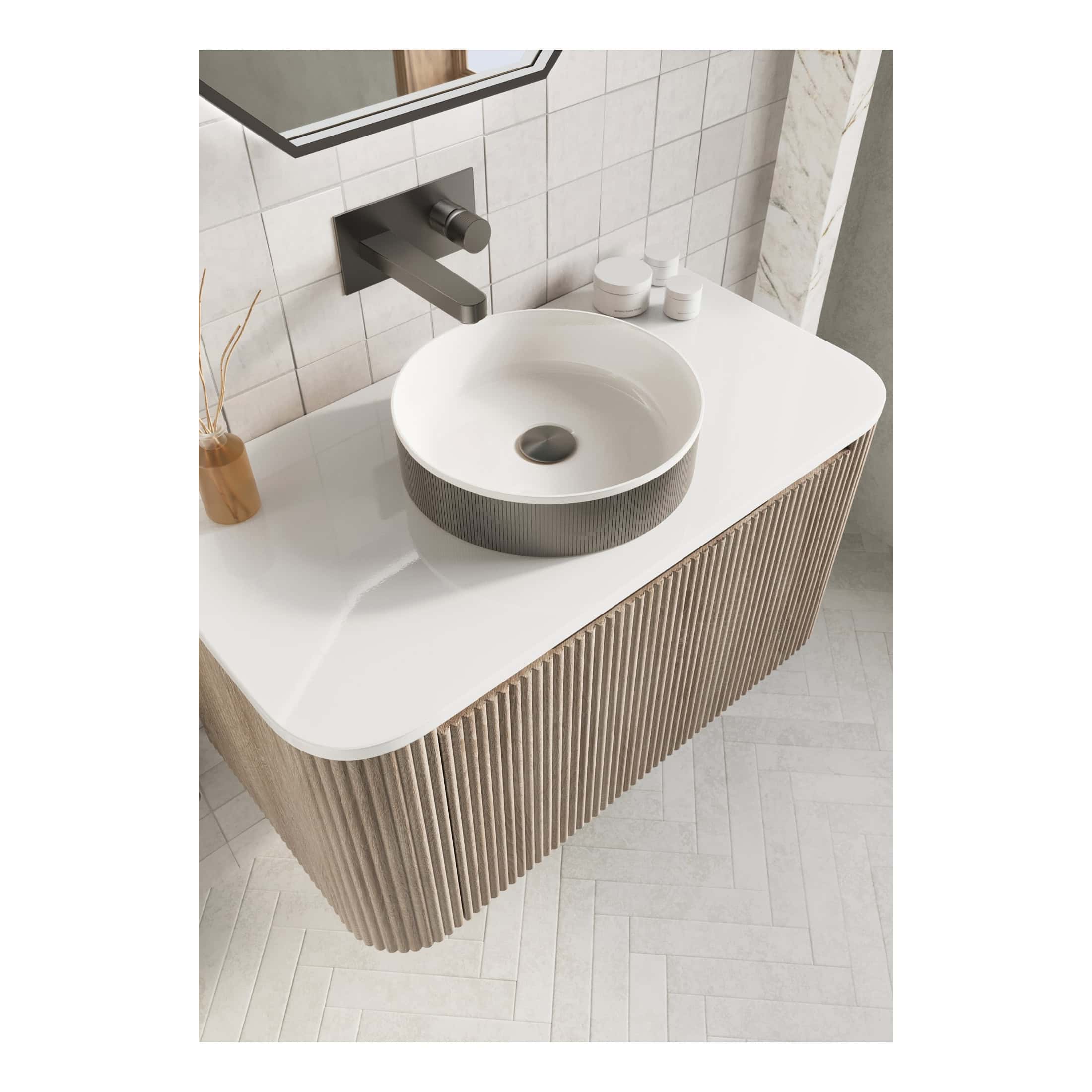 Sleek modern bathroom vanity with a round vessel sink, wall-mounted faucet, and minimalist design in neutral tones, perfect for contemporary bathroom interiors.